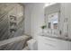 Elegant bathroom showcasing a tub with glass enclosure, marble details, and stylish vanity at 629 Majestic Rim Dr, Henderson, NV 89012