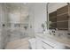 Modern bathroom featuring a glass-enclosed shower, white marble tiling, and sleek fixtures at 629 Majestic Rim Dr, Henderson, NV 89012