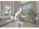 Elegant bathroom with marble walk-in shower and modern vanity at 629 Majestic Rim Dr, Henderson, NV 89012