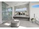 Bright and spacious bathroom with a walk-in shower, dual vanity, and luxurious marble accents throughout at 629 Majestic Rim Dr, Henderson, NV 89012