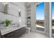 Luxury bathroom with modern fixtures, marble accents, and access to a private outdoor area with scenic views at 629 Majestic Rim Dr, Henderson, NV 89012