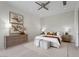Cozy bedroom featuring stylish decor, artwork, and a comfortable seating area at 629 Majestic Rim Dr, Henderson, NV 89012