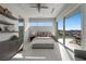 Bright bedroom featuring large sliding glass doors to patio and golf course views at 629 Majestic Rim Dr, Henderson, NV 89012