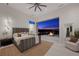 Serene bedroom with city views and a cozy outdoor fireplace area at 629 Majestic Rim Dr, Henderson, NV 89012