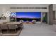 Elegant dining room with panoramic views, modern lighting, and seamless indoor-outdoor living space at 629 Majestic Rim Dr, Henderson, NV 89012