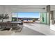 Open-concept dining and living area with floor-to-ceiling sliding doors offering panoramic views of the city at 629 Majestic Rim Dr, Henderson, NV 89012