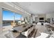 Elegant dining room featuring a large table, city views, and access to outdoor space at 629 Majestic Rim Dr, Henderson, NV 89012