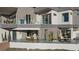 Modern home exterior with multiple outdoor living spaces and sleek architectural design at 629 Majestic Rim Dr, Henderson, NV 89012