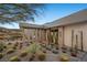 Striking modern home featuring desert landscaping with a variety of cactus and succulent plants at 629 Majestic Rim Dr, Henderson, NV 89012