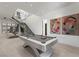Stylish game room featuring a pool table, artwork, and access to a dining area with stunning views at 629 Majestic Rim Dr, Henderson, NV 89012