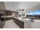 Modern kitchen features a large island, sleek cabinets, and stainless steel appliances at 629 Majestic Rim Dr, Henderson, NV 89012