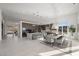Bright open living space featuring a modern kitchen, dining area, and access to outdoor views at 629 Majestic Rim Dr, Henderson, NV 89012