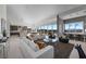 Bright living room features mountain views, modern decor, open layout with kitchen, and plenty of natural light at 629 Majestic Rim Dr, Henderson, NV 89012