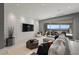 Inviting living room with plush seating, textured wall, and sliding glass doors to a scenic outdoor space at 629 Majestic Rim Dr, Henderson, NV 89012