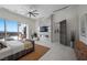Bright main bedroom with a fireplace, a ceiling fan, and private balcony overlooking the city at 629 Majestic Rim Dr, Henderson, NV 89012