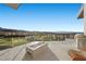 Outdoor patio with a modern fire pit, built-in grill, and panoramic city views at 629 Majestic Rim Dr, Henderson, NV 89012