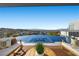Relaxing infinity pool overlooking the city, surrounded by comfortable lounge seating at 629 Majestic Rim Dr, Henderson, NV 89012