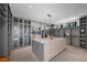 Spacious walk-in closet with custom shelving, center island, and ample storage at 629 Majestic Rim Dr, Henderson, NV 89012