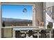Stylish wet bar area featuring a large window with stunning city views, perfect for entertaining guests at 629 Majestic Rim Dr, Henderson, NV 89012