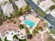 Community pool and common areas amongst neighborhood houses for recreation and relaxation at 6325 Snap Ridge St # 102, North Las Vegas, NV 89081