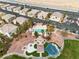 Aerial view of community pool, playground, and picnic areas surrounded by lush landscaping at 6325 Snap Ridge St # 102, North Las Vegas, NV 89081