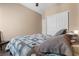 Spacious bedroom features carpet, large closet and neutral color palette at 6325 Snap Ridge St # 102, North Las Vegas, NV 89081