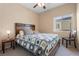 Bedroom has carpeted floors and a large window at 6325 Snap Ridge St # 102, North Las Vegas, NV 89081