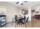 Charming dining room with a cozy breakfast nook and a view into an adjacent living area at 6325 Snap Ridge St # 102, North Las Vegas, NV 89081