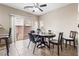 Dining area featuring sliding glass doors to the backyard and an adjacent breakfast bar at 6325 Snap Ridge St # 102, North Las Vegas, NV 89081