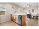 Lovely kitchen featuring wood cabinets, a sink, and a table and chairs at 6325 Snap Ridge St # 102, North Las Vegas, NV 89081