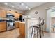 Modern kitchen with bar seating and stainless steel appliances at 6325 Snap Ridge St # 102, North Las Vegas, NV 89081