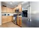 Bright kitchen featuring stainless steel appliances and ample counter space at 6325 Snap Ridge St # 102, North Las Vegas, NV 89081