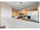 Bright kitchen with stainless steel refrigerator and stove at 6325 Snap Ridge St # 3, North Las Vegas, NV 89081