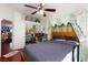 Bedroom showcasing hardwood floors, a king-size bed, and ample natural light at 6578 Chimes Tower Ave, Las Vegas, NV 89139