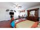 This main bedroom features hard wood floors, ceiling fan, and plenty of space at 6578 Chimes Tower Ave, Las Vegas, NV 89139