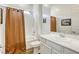 Bright bathroom featuring a shower-tub combo and a single sink vanity with modern fixtures at 762 Lilac Oak St, Henderson, NV 89011