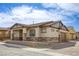 Attractive home exterior with lovely landscaping, great curb appeal, and comfortable front porch at 762 Lilac Oak St, Henderson, NV 89011