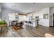 Bright living space featuring wood floors, recessed lighting, and an open layout connecting to the kitchen at 762 Lilac Oak St, Henderson, NV 89011