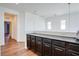 Bright kitchen area featuring modern cabinets, hardwood floors and bright, neutral wall color at 7664 Mallard Bay Ave, Las Vegas, NV 89179