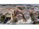 An aerial view of the neighborhood showcasing multiple homes, streets, and surrounding desert landscape at 8646 Mesquite Hills St, Las Vegas, NV 89139