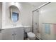 Well-lit bathroom featuring a single vanity, a toilet, and a glass-enclosed shower at 8646 Mesquite Hills St, Las Vegas, NV 89139