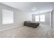 Bright bedroom features plush carpeting, neutral walls, and multiple windows allowing for ample natural light at 8646 Mesquite Hills St, Las Vegas, NV 89139