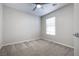 Neutral toned bedroom with plush carpeting, ceiling fan and window at 8646 Mesquite Hills St, Las Vegas, NV 89139