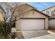 Attached garage with a driveway and landscaping that frames the front of the home at 8646 Mesquite Hills St, Las Vegas, NV 89139