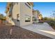Two-story home featuring a clean concrete patio, xeriscape, and a covered patio at 88 Pristine Glen St, Las Vegas, NV 89135