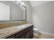 This bathroom includes granite countertops, dark cabinets, and a modern mirror at 88 Pristine Glen St, Las Vegas, NV 89135