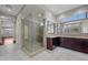 Elegant bathroom featuring a glass-enclosed shower, granite counters, and abundant vanity storage at 88 Pristine Glen St, Las Vegas, NV 89135