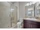 This bathroom features a tile shower with a glass door, granite counters, and updated cabinets at 88 Pristine Glen St, Las Vegas, NV 89135