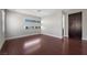 Bedroom with hardwood floors, natural light and an ensuite bathroom and wardrobe at 88 Pristine Glen St, Las Vegas, NV 89135