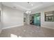 Elegant dining room with a chandelier, tile flooring, and access to an outdoor space at 88 Pristine Glen St, Las Vegas, NV 89135